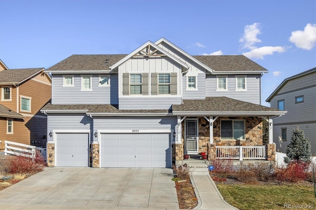 craftsman inspired home with covered porch and a garage