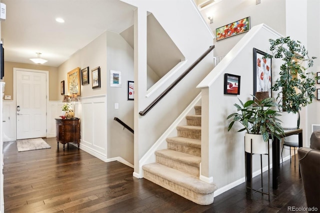 foyer entrance with dark hardwood / wood-style floors