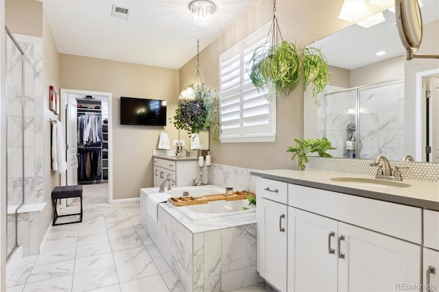 bathroom with vanity and plus walk in shower