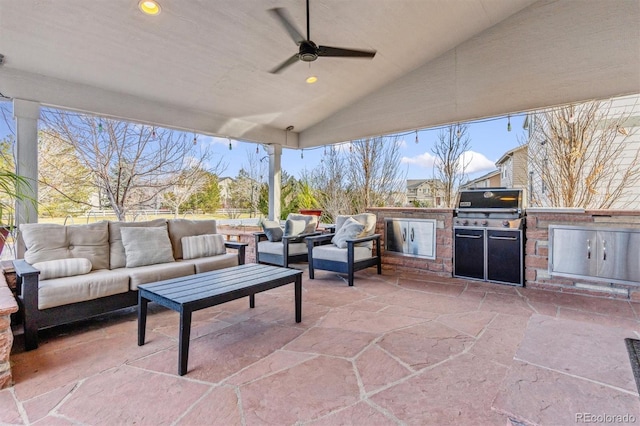 view of patio / terrace featuring an outdoor living space, an outdoor kitchen, and ceiling fan