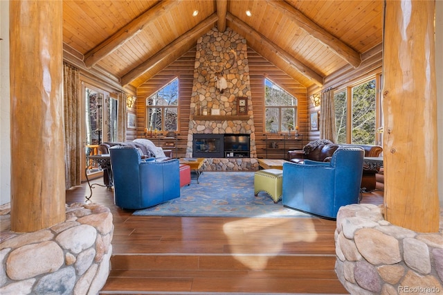 105 Windflower Ln, Frisco, CO 80443 - living room with hardwood / wood-style flooring, a wood ceiling with exposed beams, a fireplace, high vaulted ceiling, and rustic walls