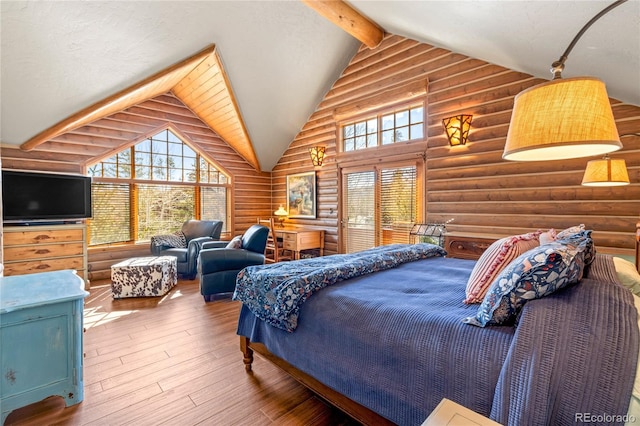 105 Windflower Ln, Frisco, CO 80443 - bedroom with rustic walls, hardwood / wood-style floors, beamed ceiling, and high vaulted ceiling