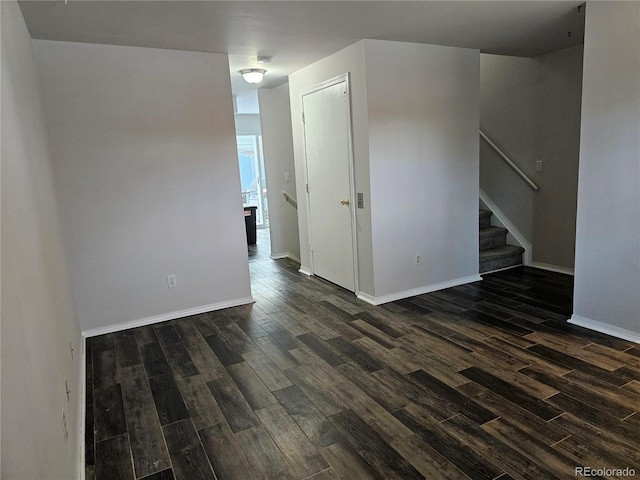 spare room featuring dark wood-type flooring