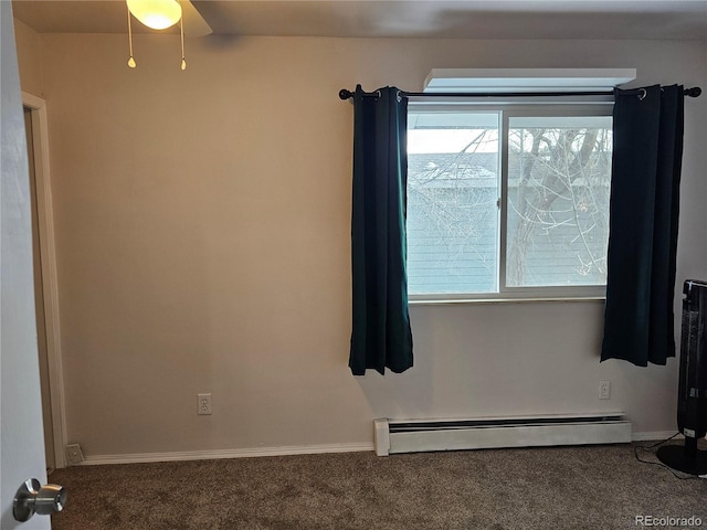 unfurnished room with baseboard heating and carpet flooring