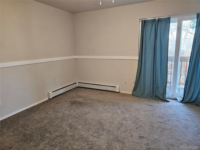 unfurnished room with a baseboard radiator and carpet floors