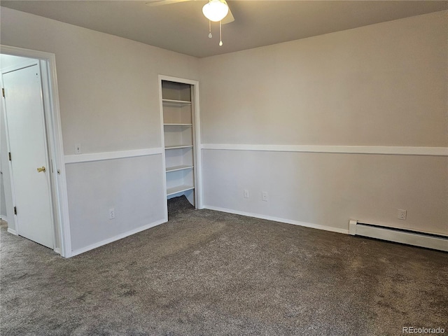 spare room with baseboard heating, ceiling fan, and dark carpet