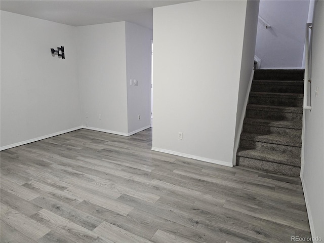 spare room with light hardwood / wood-style flooring