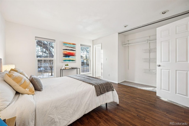 bedroom featuring dark wood-type flooring