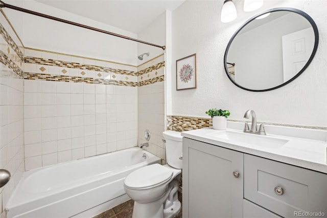 full bathroom with toilet, vanity, decorative backsplash, and tiled shower / bath