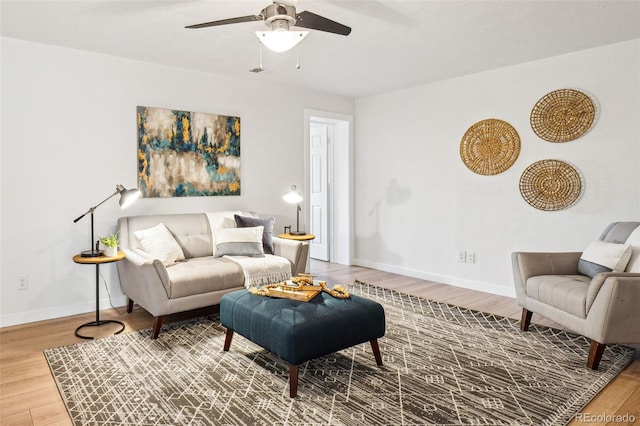 living room with hardwood / wood-style floors and ceiling fan