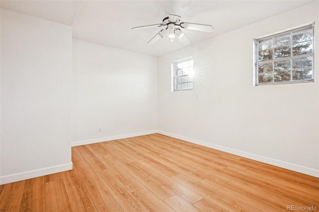 empty room featuring ceiling fan and light wood-type flooring