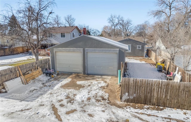 view of snow covered garage