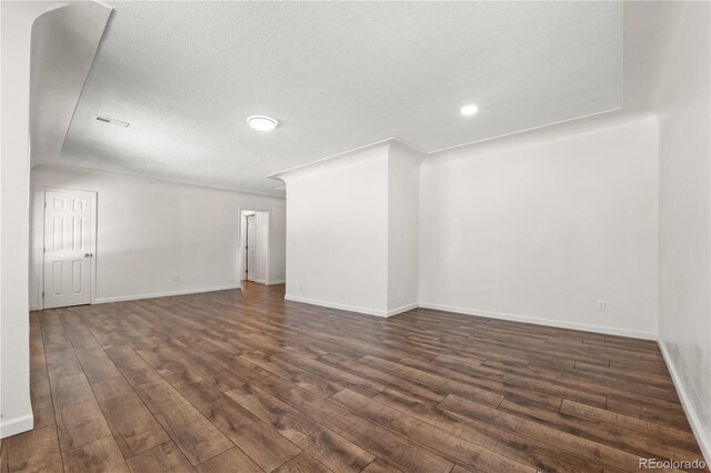 empty room featuring dark hardwood / wood-style floors