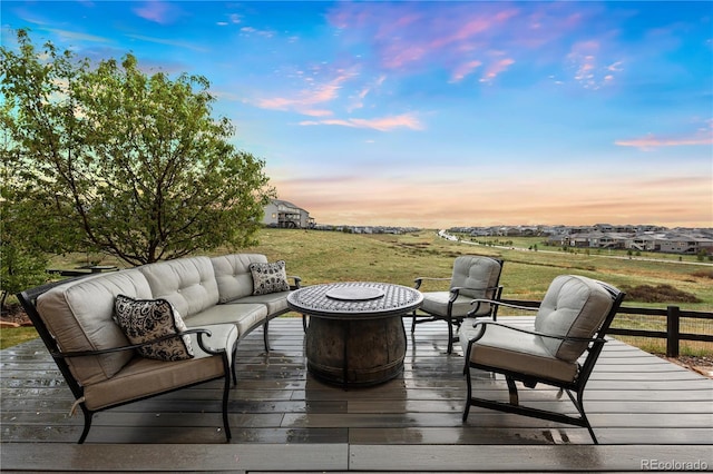 23030 E Del Norte Cir, Aurora, CO 80016 - deck at dusk with an outdoor living space with a fire pit