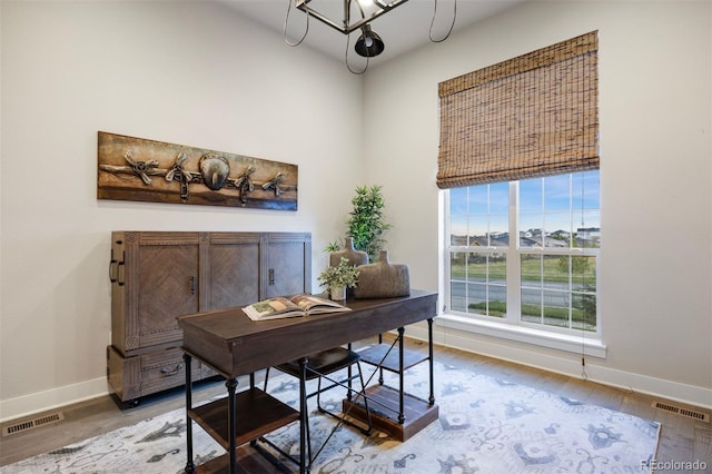 23030 E Del Norte Cir, Aurora, CO 80016 - office area featuring wood finished floors and a chandelier