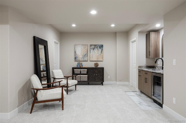 23030 E Del Norte Cir, Aurora, CO 80016 - sitting room with wine cooler, recessed lighting, and light colored carpet