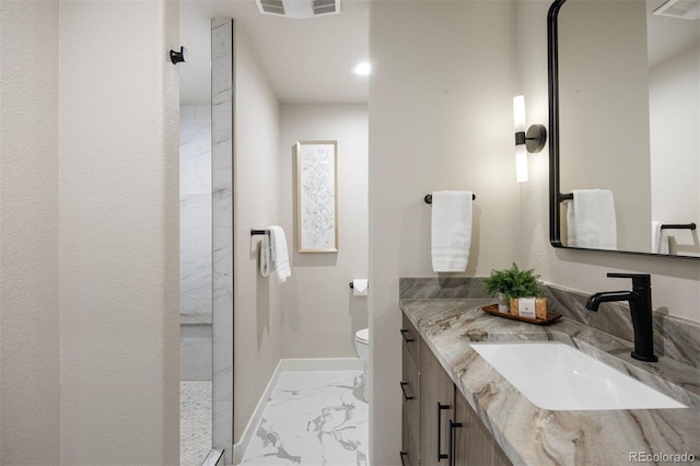23030 E Del Norte Cir, Aurora, CO 80016 - bathroom featuring marble finish flooring, vanity, and walk in shower