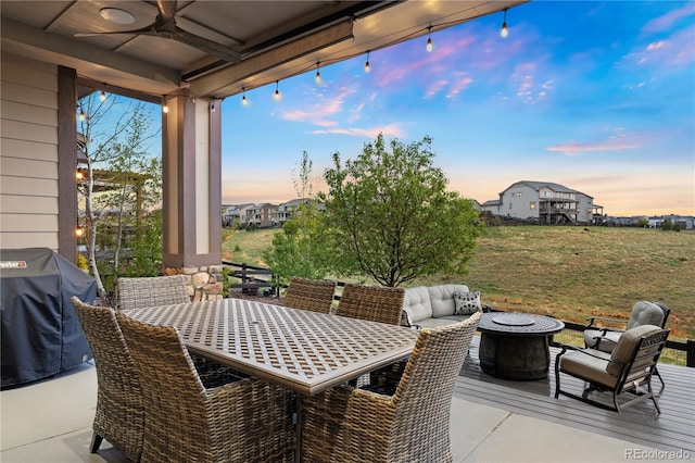 23030 E Del Norte Cir, Aurora, CO 80016 - view of patio / terrace featuring grilling area, ceiling fan, a fire pit, and outdoor dining area