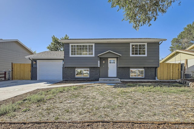 split foyer home featuring a garage