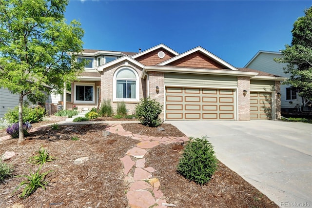 1313 Iris Cir, Broomfield, CO 80020 - view of front of house with an attached garage, brick siding, and concrete driveway