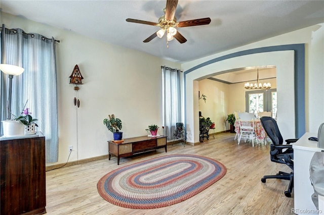 1313 Iris Cir, Broomfield, CO 80020 - office space featuring arched walkways, wood finished floors, ceiling fan, and a chandelier