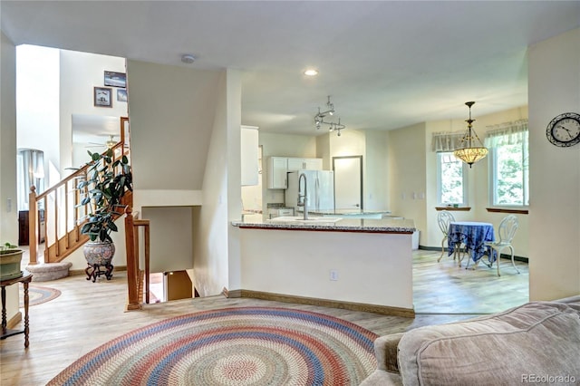 1313 Iris Cir, Broomfield, CO 80020 - living room with light wood-style floors and stairway