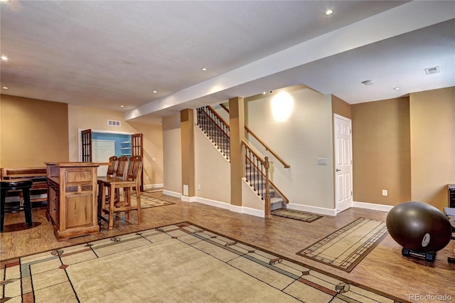 1313 Iris Cir, Broomfield, CO 80020 - interior space featuring recessed lighting, stairway, and bar area