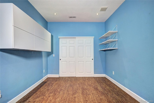 1313 Iris Cir, Broomfield, CO 80020 - unfurnished bedroom with dark wood-type flooring, a closet, and recessed lighting