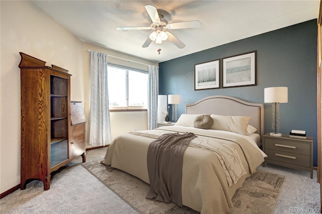 1313 Iris Cir, Broomfield, CO 80020 - bedroom with light carpet and a ceiling fan
