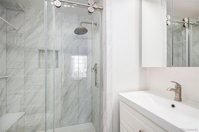 bathroom featuring a stall shower and vanity