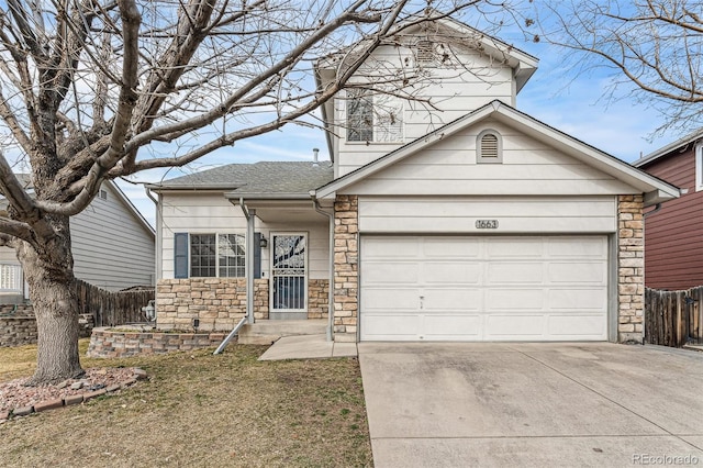 traditional home featuring an attached garage, a shingled roof, fence, stone siding, and concrete driveway