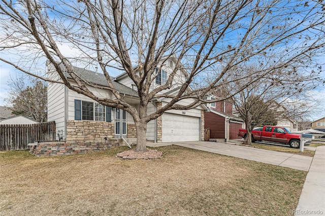 view of front facade featuring a garage, concrete driveway, stone siding, fence, and a front lawn