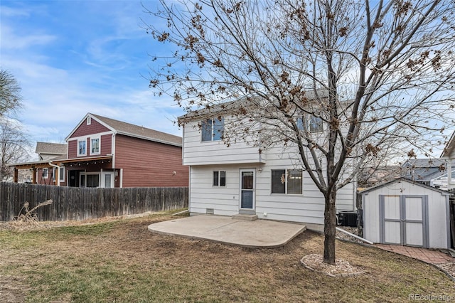 rear view of property featuring a patio, central AC unit, an outdoor structure, fence, and a storage unit