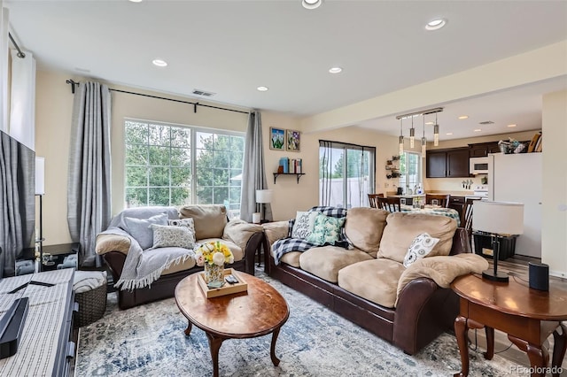 5535 Flanders Way, Denver, CO 80249 - living area with plenty of natural light and recessed lighting