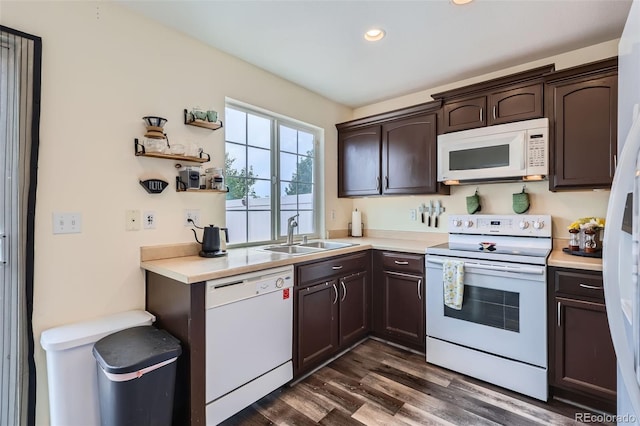 5535 Flanders Way, Denver, CO 80249 - kitchen featuring white appliances, dark brown cabinets, light countertops, dark wood-style flooring, and recessed lighting