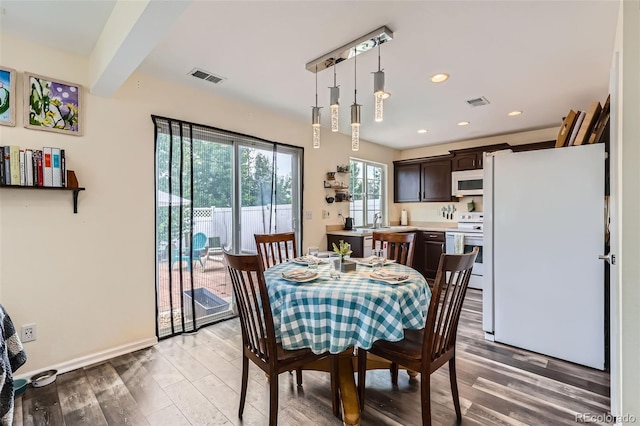 5535 Flanders Way, Denver, CO 80249 - dining space featuring light wood-type flooring and recessed lighting