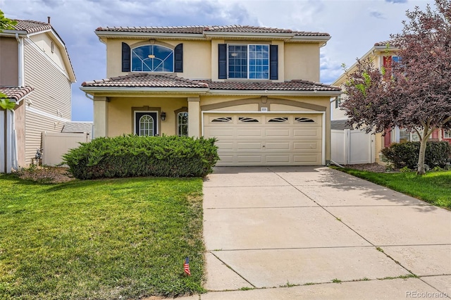 5535 Flanders Way, Denver, CO 80249 - view of front of home with concrete driveway, an attached garage, stucco siding, and a tiled roof