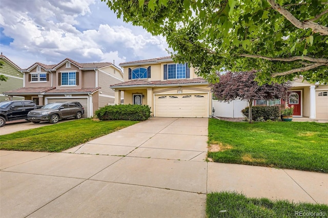 5535 Flanders Way, Denver, CO 80249 - mediterranean / spanish home featuring a garage, driveway, stucco siding, and a front lawn