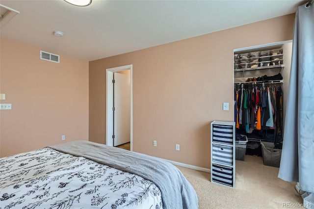 5535 Flanders Way, Denver, CO 80249 - bedroom featuring a spacious closet, a closet, and light carpet