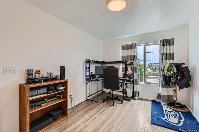 5535 Flanders Way, Denver, CO 80249 - office area featuring wood finished floors and baseboards