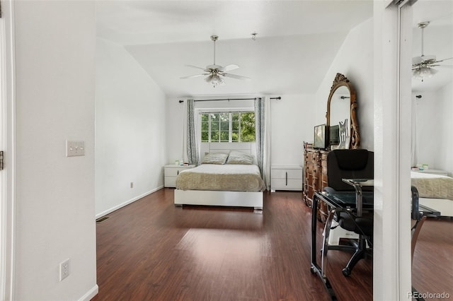 1885 S Quebec Way Unit G104, Denver, CO 80231 - bedroom with vaulted ceiling, dark wood-type flooring, baseboards, and a ceiling fan