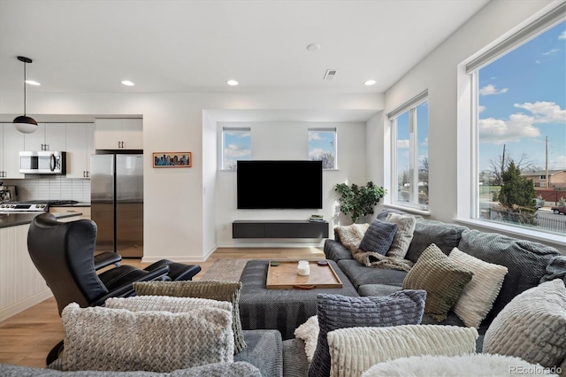 3101 W 47th Ave Unit 14, Denver, CO 80211 - living room with light wood-style flooring, recessed lighting, and baseboards