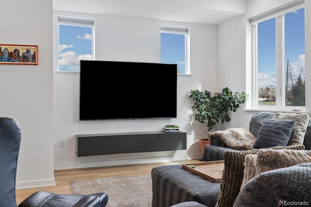 3101 W 47th Ave Unit 14, Denver, CO 80211 - living area featuring healthy amount of natural light and wood finished floors