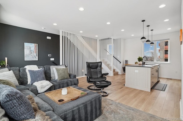 3101 W 47th Ave Unit 14, Denver, CO 80211 - living area featuring light wood-type flooring, stairs, recessed lighting, and baseboards