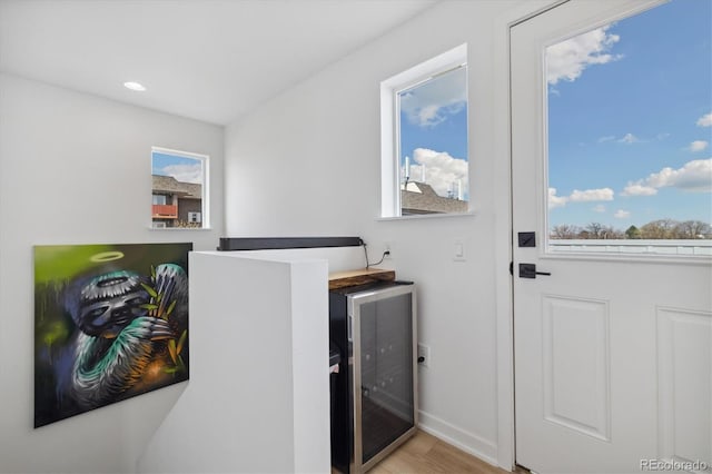 3101 W 47th Ave Unit 14, Denver, CO 80211 - washroom with wine cooler, baseboards, wood finished floors, and recessed lighting