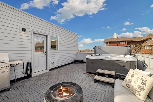 3101 W 47th Ave Unit 14, Denver, CO 80211 - view of patio / terrace with a hot tub, an outdoor fire pit, and fence