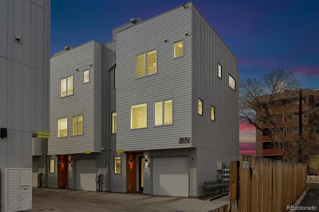 3101 W 47th Ave Unit 14, Denver, CO 80211 - multi unit property featuring a garage, driveway, and fence
