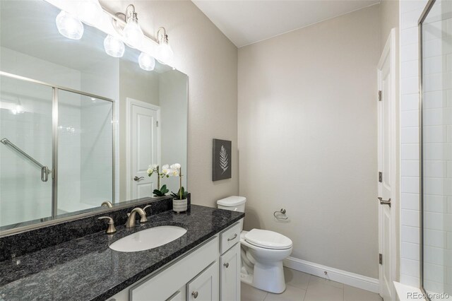 9992 W Victoria Pl Unit 103, Littleton, CO 80127 - bathroom featuring vanity, a shower stall, and tile patterned floors