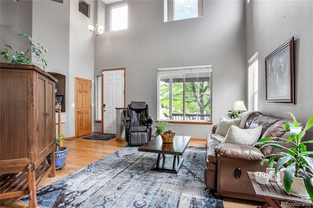 9644 S Estes Way, Littleton, CO 80127 - living area with a high ceiling and light wood-type flooring