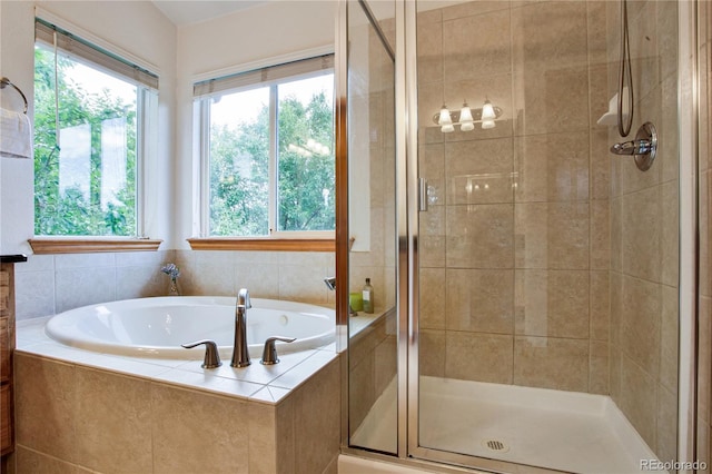 9644 S Estes Way, Littleton, CO 80127 - full bathroom with a shower stall, healthy amount of natural light, and a garden tub